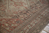 Even wear on a Persian Shiraz carpet, highlighting geometric patterns in chestnut brown.