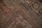 Distressed Shiraz rug corner, showing geometric pattern, low pile, and newly hand-stitched selvage.
