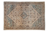Distressed vintage Kamseh carpet, featuring a central stepped medallion, tribal motifs, and faded teal, ivory, brown tones.