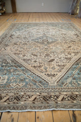 Distressed Kamseh rug fringe and geometric border in chocolate brown and cream with worn pile.