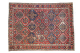 Vintage Bakhtiari carpet with diamond lattice, garden motifs, cherry red and sapphire blue.