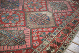 Vintage Bakhtiari carpet, lattice diamond field and crab border in brick red, sapphire blue.