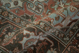 Textured pile of vintage distressed Heriz rug with abrash in soft chestnut and slate blue.
