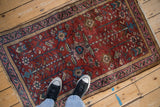 Antique Lilihan rug corner, featuring camel minor border and faded magenta main border.