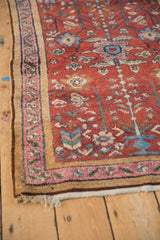Antique Lilihan rug corner highlighting cherry red field, faded magenta, and camel-colored borders.