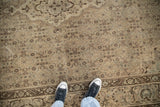 Distressed traditional Persian Bijar carpet field with faded beige and brown Herati design.