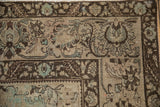 Distressed vintage Bijar carpet corner, beige, chocolate, faded blue Herati pattern.