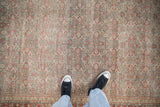 Distressed vintage Tabriz carpet with faded cherry red and slate blue Herati patterns.