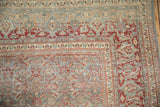 Distressed Tabriz carpet corner featuring Herati field and Samovar Turtle border.
