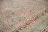 Distressed Tabriz rug detail: Herati field and Samovar Turtle border in muted cherry red.