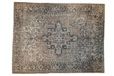 Vintage distressed Heriz carpet with concentric medallion, floral motifs, beige, charcoal, and dusty teal.