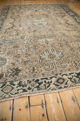Distressed selvage and geometric turtle samovar border of a vintage Heriz rug.