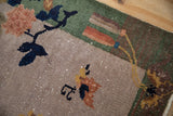 Antique Chinese Art Deco rug pile with dusty mauve and navy blossoms and faint foundation.