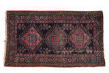 Antique Mehriban rug, triple diamond medallions on dark navy, raspberry, sky blue. Visible wear.
