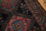 Antique Mehriban rug detail: serrated leaf border, geometric field, and wear revealing foundation.