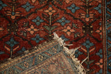 Vintage Mehriban rug: sapphire, burgundy tree-of-life motifs, pile wear, tattered fringe, woven back.