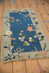 Antique Art Deco runner, celadon border with white and pink floral motifs on cobalt.