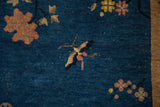 Gold butterfly and dusty blush florals on the antique Art Deco cobalt blue pile.