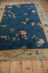 Antique Art Deco rug: aged pale seafoam border, cobalt blue floral field.