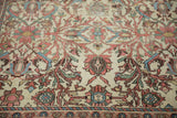 Close-up of the fine antique Malayer rug's intricate floral and palmette pattern, showing its low pile and hand-knotted texture.
