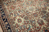 Antique Malayer rug's ivory field showing wear to the knot heads and underlying foundation.