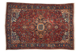 Antique Malayer rug with a stepped center medallion, intricate floral field, and sapphire blue accents.