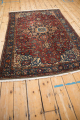 Intricate floral design and even pile of an antique Malayer rug from a dramatic low angle.