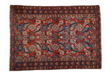 Antique Persian Malayer rug with a large scale Herati design in gem-like ruby red and sapphire blue.