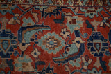 Close-up of the large Herati design motif on an antique Malayer rug in ruby red and sapphire blue.