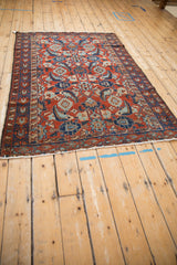 Angled perspective of a fine antique Malayer rug highlighting its traditional Herati pattern.