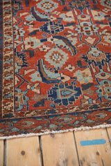 Low pile with visible knot heads and border detail on a red and blue antique Malayer rug.