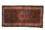 Vintage Kurdish Hamadan rug with a triple medallion, red and blue tree of life motifs, on a dark chocolate brown field.