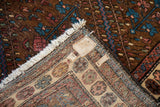 Hand-knotted foundation and weave visible on the back corner of a vintage Kurdish Hamadan rug.
