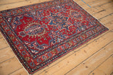 Full view of a vintage Karaja rug displaying its classic staggered quatrefoil medallions.