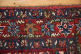 Hand-knotted texture of the geometric palmette border and side cord on a fine Karaja rug.