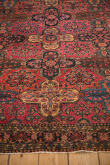 Antique Sarouk rug, intricate raspberry, navy, gold inverted panel pomegranate pattern.