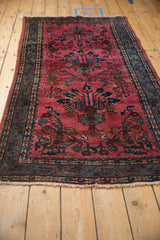Raspberry red field and denim blue meandering vine border on vintage Persian Lilihan rug.