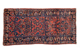Vintage Persian Lilihan rug with a dusty rose floral field and a navy blue palmette border.