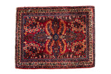 Vintage Sarouk square rug with floral bouquets on a cherry red field with sapphire blue and sand accents.