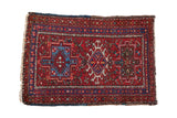 Vintage Karaja rug with brick red field, geometric triple medallions, blue, and charcoal, 1'11