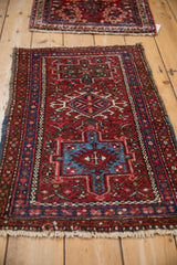 Geometric sky blue and brick red medallion pattern of a vintage Karaja rug.