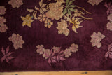 Close-up of the varied wool pile texture on floral bouquets in dusty gold and mauve.