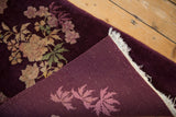 The reverse weave and hand-knotted foundation of an antique aubergine floral Art Deco rug.