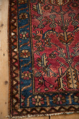Intact side cord selvage on a vintage Lilihan rug with a sapphire blue floral border.