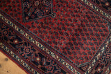 Detail of the Herati and turtle samovar motif border on a fine vintage Persian rug.