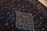 Fine weave and texture of the scalloped medallion on a vintage indigo blue Bibikabad rug.