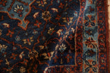 Rolled view of a vintage Bibikabad rug showing the dense wool pile and floral pattern.