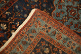 Corner detail of a fine Bibikabad rug showing the hand-knotted pile and worn ivory edge.
