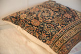 Hand-knotted vintage Persian Fereghan pillow, navy, rust, and saffron floral motifs.