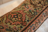 Hand-knotted vintage Fereghan pillow with intricate botanical motifs in warm tones and deep indigo.